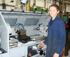 Apprentice operating a lathe at Helipebs Controls.